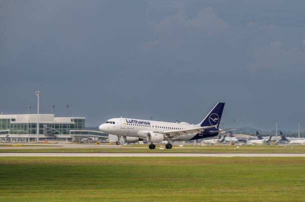 Lufthansa CityLine Airbus A319-112 with the aircraft registration D-AIBM 
is landing on the southern runway 26L of the Munich Airport MUC EDDM Munich, Germany - August 26. 2022 : Lufthansa CityLine Airbus A319-112 with the aircraft registration D-AIBM is landing on the southern runway 26L of the Munich Airport MUC EDDM munich airport stock pictures, royalty-free photos & images