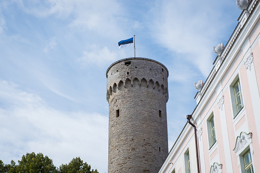 Estonian flag on top of old medieval tower Pikk Herman in Tallinn old town.