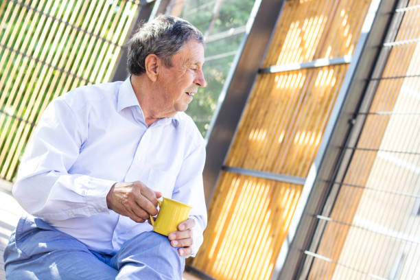 istock Smiling senior man enjoying in morning coffee 1422183753