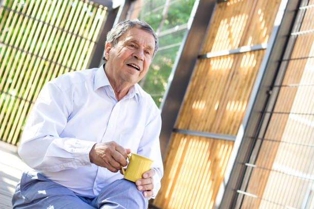 istock Smiling senior man enjoying in morning coffee 1422183774
