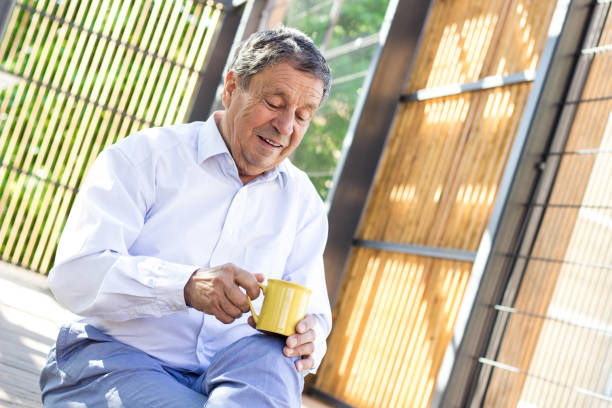 istock Smiling senior man enjoying in morning coffee 1422183797