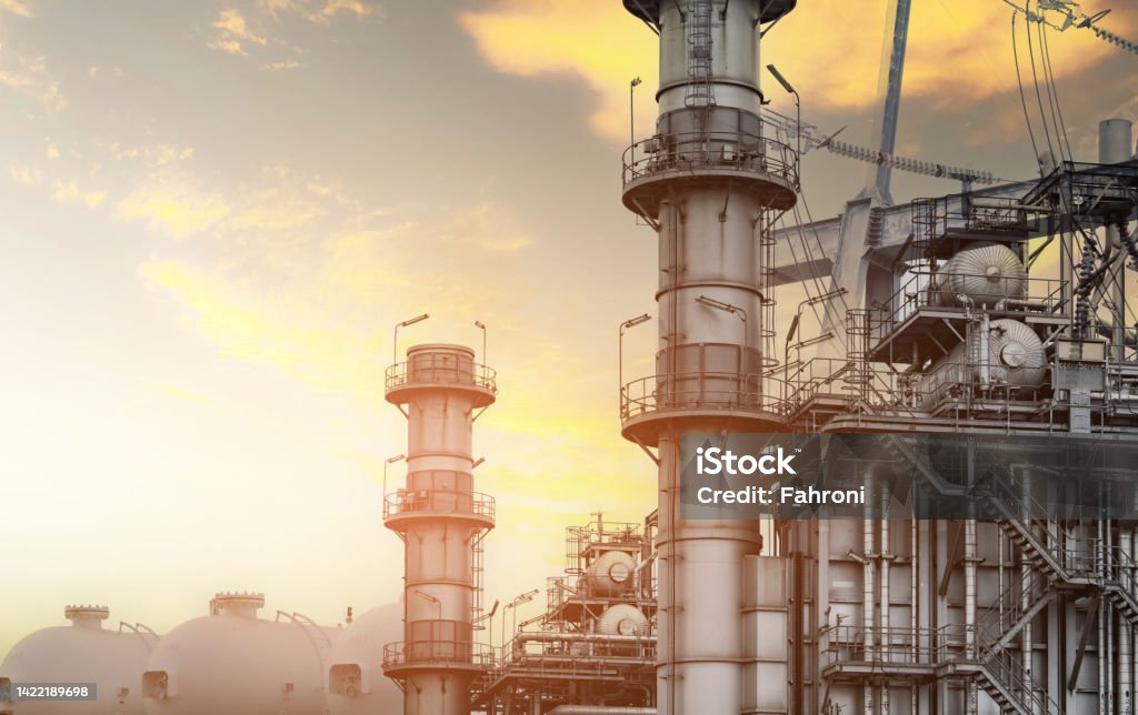 Gas turbine electrical power plant. Global energy crisis concept. Natural gas tank. Industrial gas storage tank. LNG or liquefied natural gas storage tank. Power plants with energy crisis concept. Factory Stock Photo