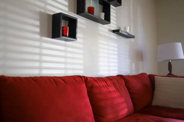 Living room interior in cosy style with sofa and lamp