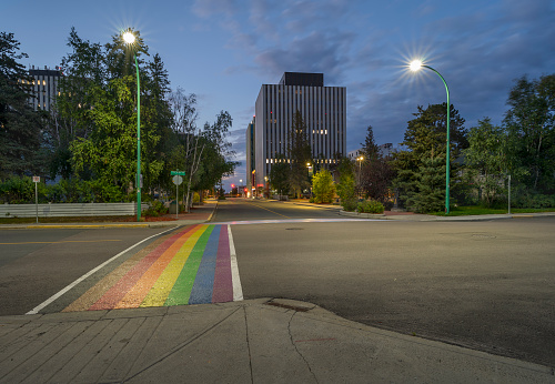 Downtown Yellowknife, Northwest Territories at dusk with a rainbow crosswalk