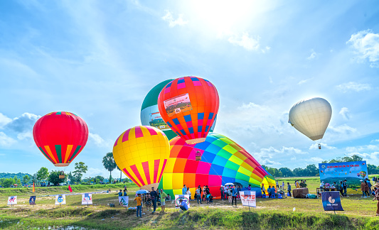 An Giang, Vietnam - September 3rd, 2022: The hot air balloon festival in Ta Pa field after the harvest attracts people to attend and watch. This is the national day celebration in An Giang, Vietnam
