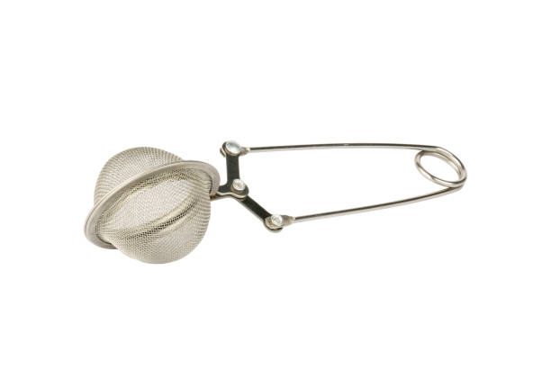 istock sieve for tea on white background. metal teapot 1422195327