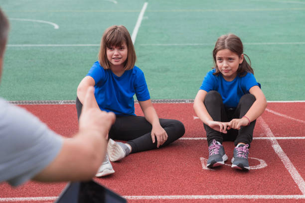 istock Coach talking to teen athletes 1422203457
