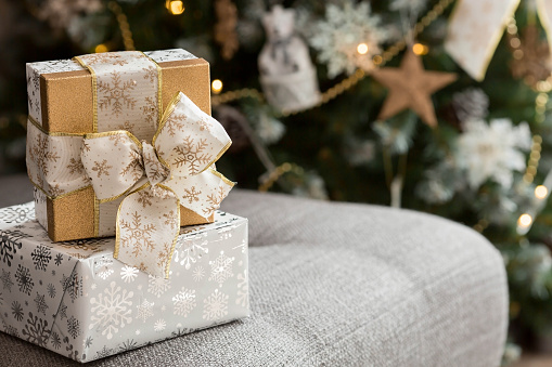 Boxes with gifts under the Christmas tree.