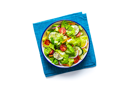 Overhead view of a healthy green vegetables salad isolated on white background. High resolution 42Mp studio digital capture taken with SONY A7rII and Zeiss Batis 40mm F2.0 CF lens