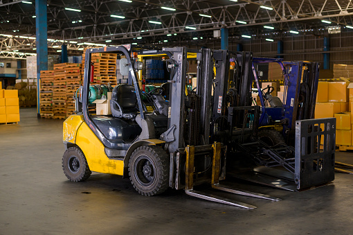Forklift loader in warehouse, machinery and Logistics concept.