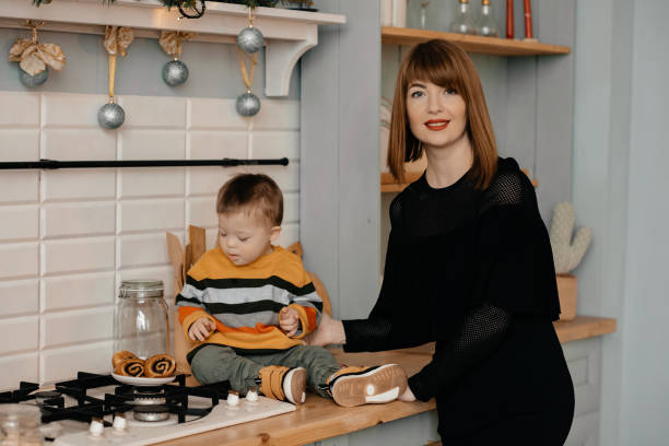 istock Mom cooks dinner with her son with special needs. 1422209174