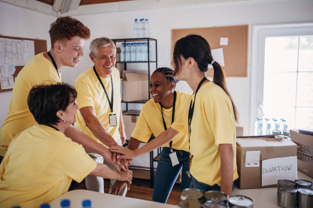 istock Happy charity volunteers 1422211861