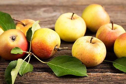 Organic apples on the old table