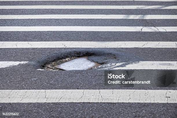 Pot Hole In A Zebra Crossing Stock Photo - Download Image Now - High Angle View, Pot Hole, City