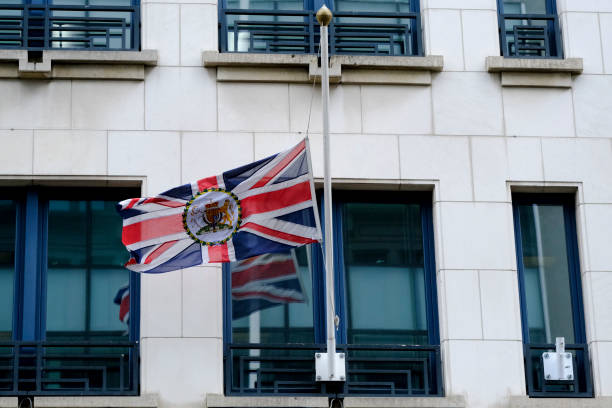 the union flag at half-mast, brussels - british flag freedom photography english flag imagens e fotografias de stock