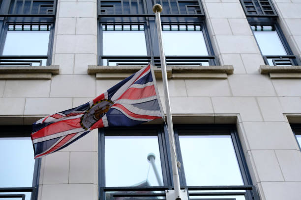 the union flag at half-mast, brussels - british flag freedom photography english flag imagens e fotografias de stock