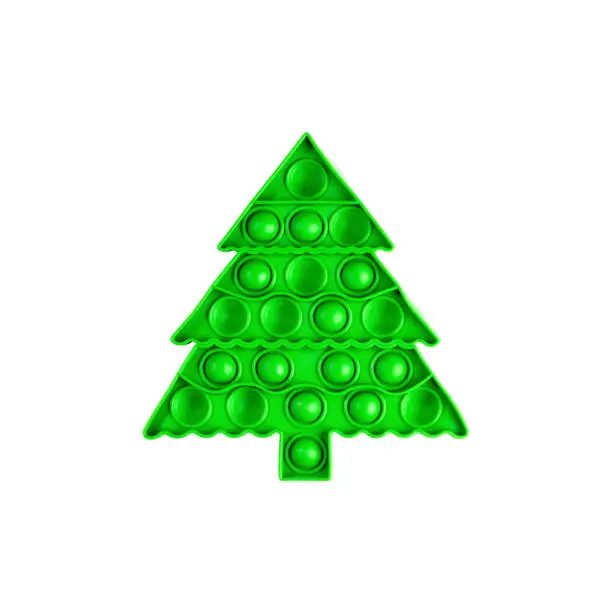 Photo of One trendy popular child anti stress pop it toy in form of green Christmas tree isolated on white.