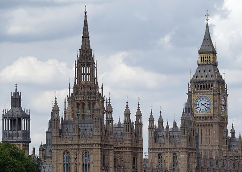 London, UK - August 1, 2022: A partial closeup of Big Ben and the Palace of Westminster in London, UK.