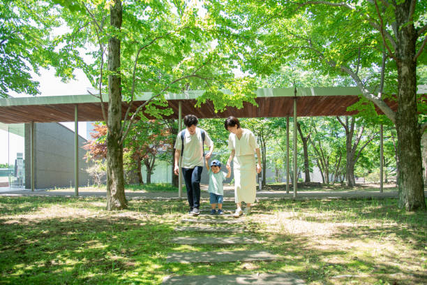 Japanese family holding hands while walking