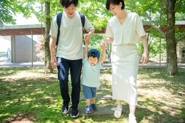 istock Japanese family holding hands while walking 1422219927