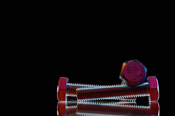istock composition of bolts and nuts of different sizes on a black background. 1422221851