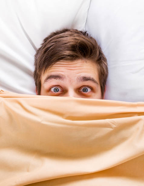 istock Worried Man in the Bed 1422226847