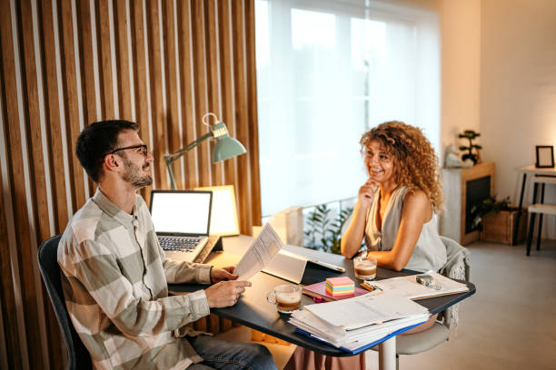 istock Young couple works together 1422230514