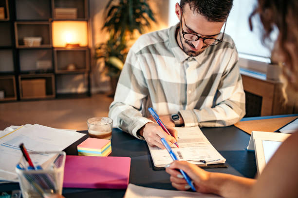 istock Beautiful couple at home office, 1422231007
