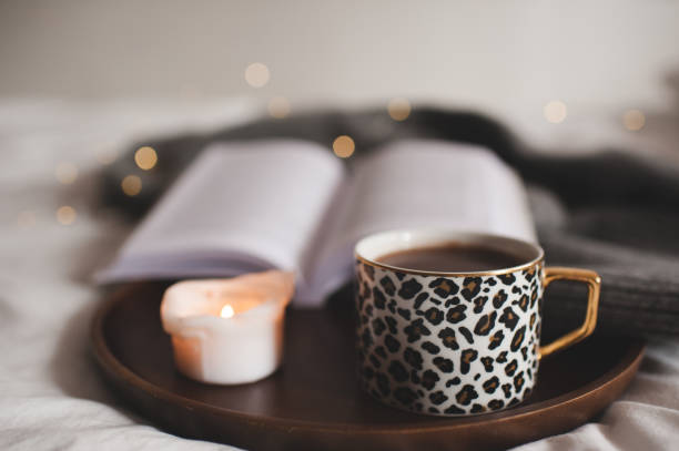istock Cup of coffee with home perfume in bed 1422233543