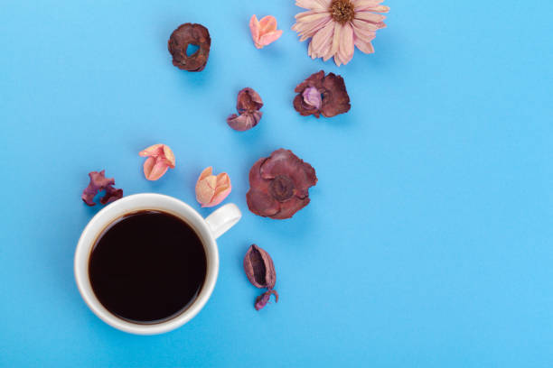 istock Cup of coffee on a blue table 1422234087