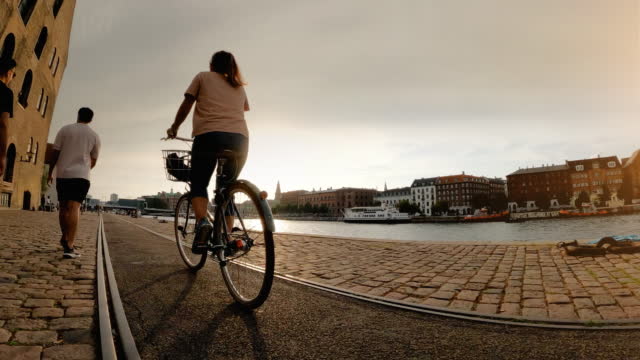 POV riding a urban road city bicycle in Copenhagen with friends