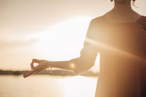 istock Beautiful Indian girl doing meditation standing 1422239462