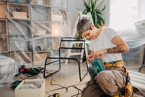 Middle-aged woman is renovating her new home