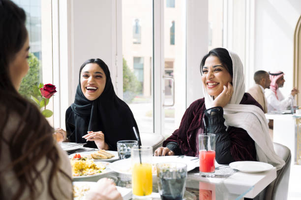 istock Relaxed Saudi businesswomen taking a break for lunch 1422240613