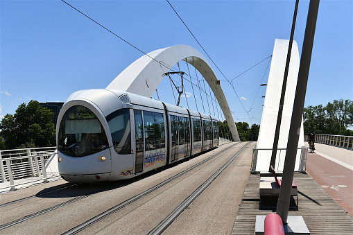 Lyon, France-06 25 2022: Tramway passing over a bridge in Lyon, France.