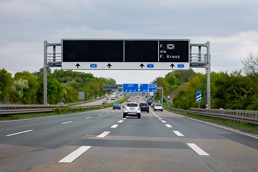 Utrecht, the Netherlands - September 29, 2011: Cars on highway A12, southwest of Utrecht, with directional signs.
