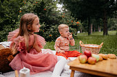 Little girl with her brother on a picnic