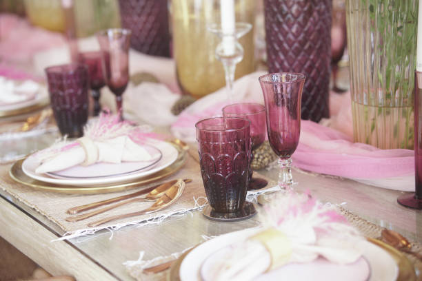 istock glass dishware on dining table. party banquet 1422251030