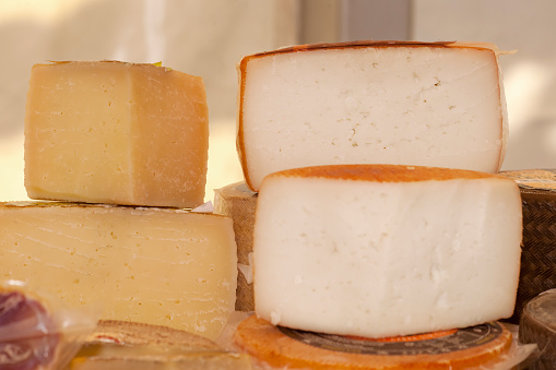 Cheese collection, hard French cheese old cantal fermier made from raw cow milk with rind close up