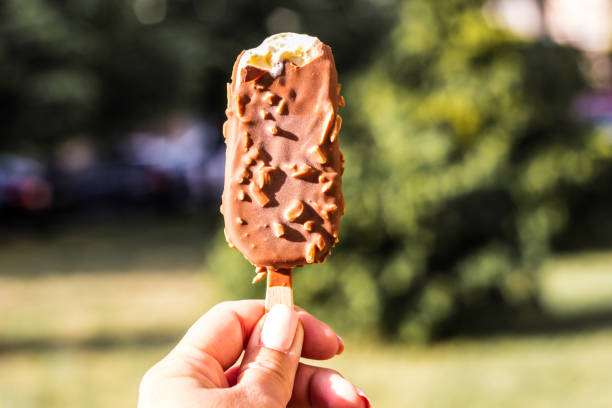 istock Woman holding chocolate ice cream 1422261068