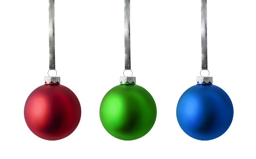 Christmas ornaments isolated on white background. Set of red, green and blue christmas balls hanging on silver ribbon.