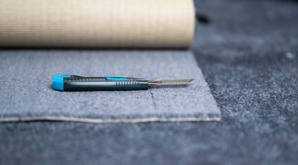 Carpet cutter placed on a new carpet.