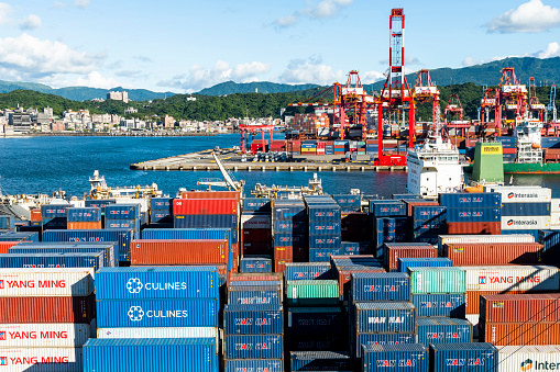 Keelung City, Taiwan- August 14, 2022: View of the container yard and crane equipment at Port of Keelung, Taiwan. It's a logistics international company.