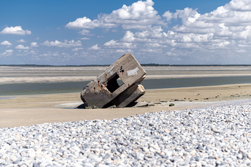 german bunker at beach of Hourdel in France at low tide on sunny summer day