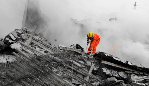istock Search and rescue forces search through a destroyed building 1422277506