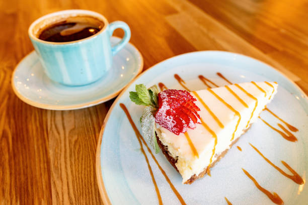 istock White cheesecake and cup of coffee 1422279410