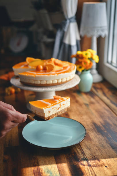 istock Creamy Orange Cheesecake with Whipped Cream 1422281109