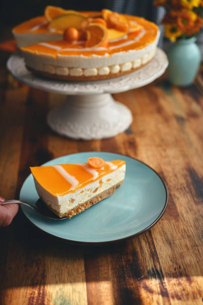 istock Creamy Orange Cheesecake with Whipped Cream 1422281112