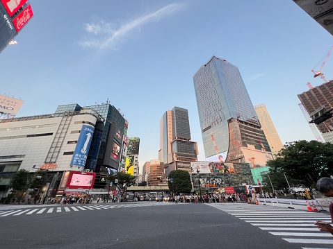 The intersection in front of the station in Shibuya, a big city in Japan. many people come and go.