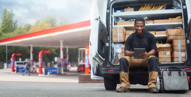 istock Service engineer sat on the back step of his van 1422282228